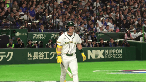 A Baseball Player Wearing A Jersey That Says Australia Holds A Bat GIF