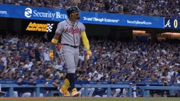 A Baseball Player Wearing A Jersey That Says Braves Is Running Towards The Dugout GIF