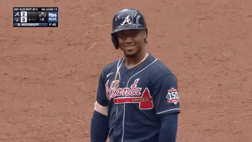 A Baseball Player Wearing A Jersey That Says Braves On It GIF