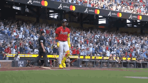 A Baseball Player Wearing A Jersey That Says Braves GIF
