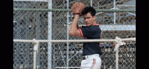 A Baseball Player Wearing A Jersey With The Letter C On It Is Throwing A Ball GIF