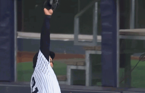 A Baseball Player Wearing A Jersey With The Number 12 On It GIF
