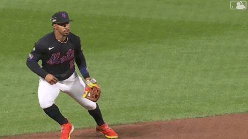 A Baseball Player Wearing A Jersey With The Number 2 On It Is Trying To Catch A Ball GIF