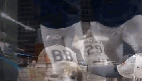 A Baseball Player Wearing A Jersey With The Number 29 On The Back GIF