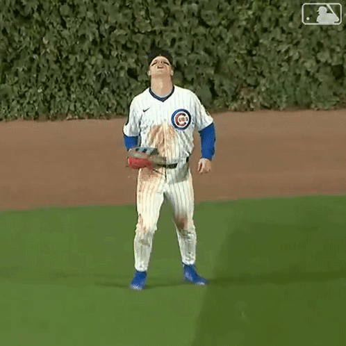 A Baseball Player Wearing A Jersey With The Number 4 On It Is Standing On The Field . GIF