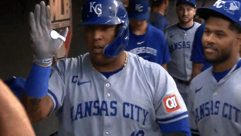 A Baseball Player Wearing A Kansas City Jersey Waving GIF