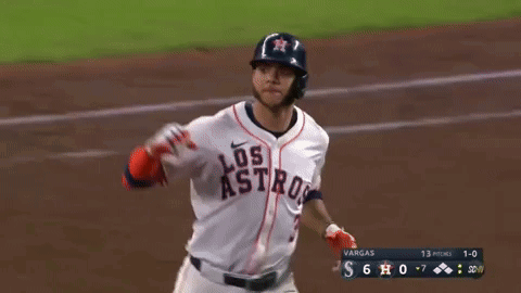 A Baseball Player Wearing A Los Astros Uniform Is Running On The Field GIF