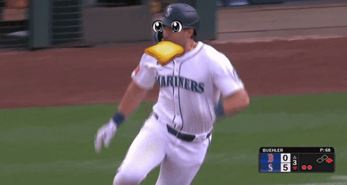 A Baseball Player Wearing A Mariners Jersey Is Running GIF