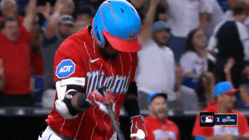A Baseball Player Wearing A Miami Jersey Holds His Bat GIF