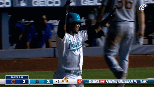 A Baseball Player Wearing A Miami Jersey Is Celebrating GIF