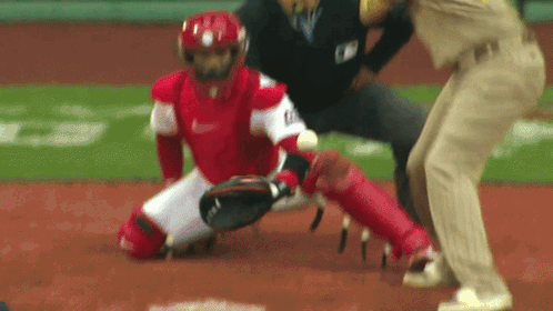 a baseball player wearing a nike uniform is kneeling down on the field