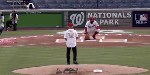 A Baseball Player Wearing A Number 19 Jersey Stands On The Mound GIF