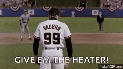 A Baseball Player Wearing A Number 99 Jersey Is Standing On A Field . GIF