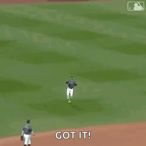 A Baseball Player Wearing A Nyc Jersey Is Walking On A Field . GIF