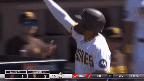 A Baseball Player Wearing A Padres Jersey Holds Up His Arm GIF