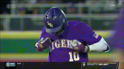A Baseball Player Wearing A Purple Jersey With The Number 10 GIF