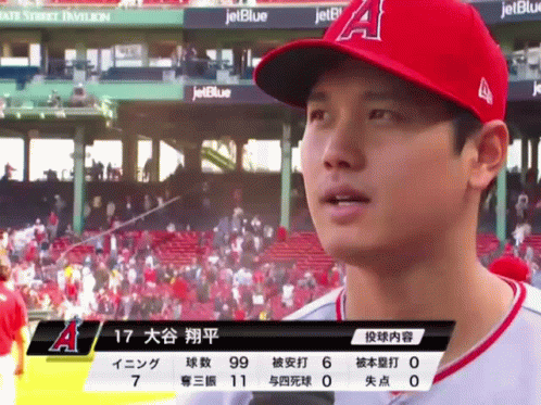 A Baseball Player Wearing A Red A Hat Stands In Front Of A Jetblue Banner GIF