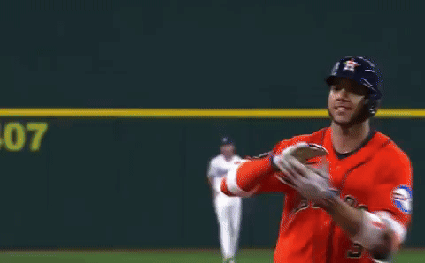 A Baseball Player Wearing A Red Astros Jersey Is Running On A Field GIF