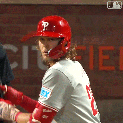 A Baseball Player Wearing A Red Helmet With A Letter P On It GIF