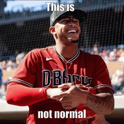 A Baseball Player Wearing A Red Jersey That Says " This Is Not Normal " On It GIF