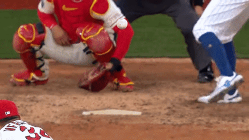 A Baseball Player Wearing A Red Jersey With The Number 33 On It GIF