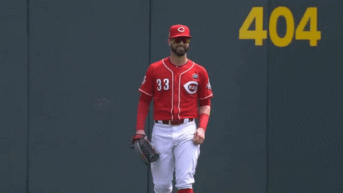 A Baseball Player Wearing A Red Jersey With The Number 33 GIF