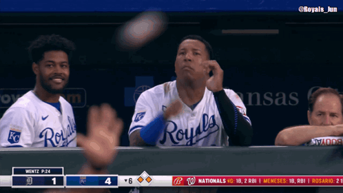A Baseball Player Wearing A Royals Jersey Throws A Ball In The Air GIF
