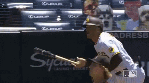 A Baseball Player Wearing A San Diego Padres Uniform Is Pointing At Something GIF
