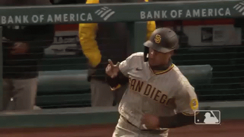 A Baseball Player Wearing A San Diego Uniform Is Running On A Baseball Field . GIF