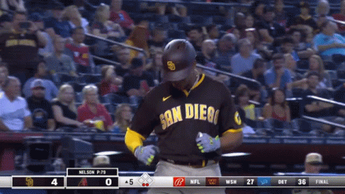 A Baseball Player Wearing A San Diego Uniform Stands In Front Of A Crowd GIF