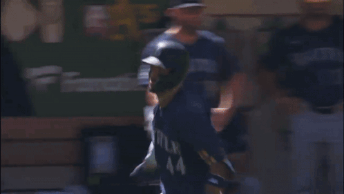 A Baseball Player Wearing A Seattle Jersey Runs On The Field GIF