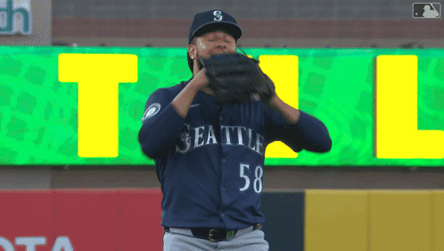 A Baseball Player Wearing A Seattle Jersey With The Number 58 GIF