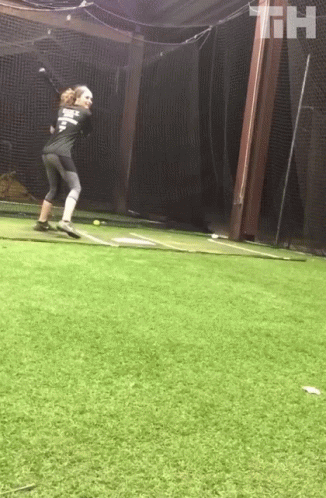 A Baseball Player Wearing A Shirt That Says ' T.h. ' On It Is Throwing A Ball GIF