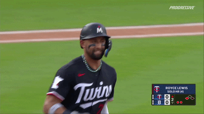 A Baseball Player Wearing A Twins Jersey Is Standing On The Field GIF