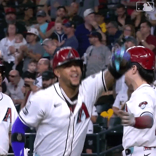 A Baseball Player Wearing A White Jersey With A Red A On The Front GIF