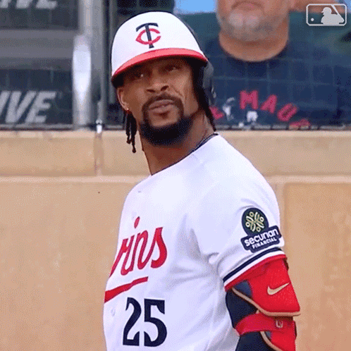 A Baseball Player Wearing A White Jersey With The Number 25 On It GIF