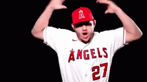 A Baseball Player Wearing A White Jersey With The Number 27 On It GIF