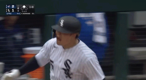 A Baseball Player Wearing A White Sox Jersey Is Running GIF