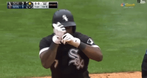A Baseball Player Wearing A White Sox Jersey Is Standing On The Field GIF