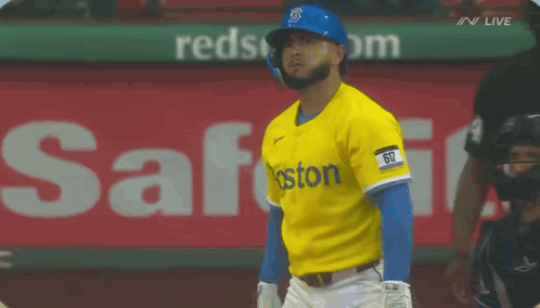 A Baseball Player Wearing A Yellow And Blue Boston Jersey GIF