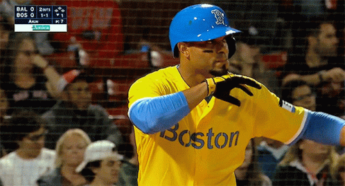 A Baseball Player Wearing A Yellow And Blue Boston Jersey GIF