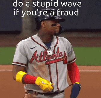 A Baseball Player Wearing An Atlanta Braves Jersey Stands On The Field GIF