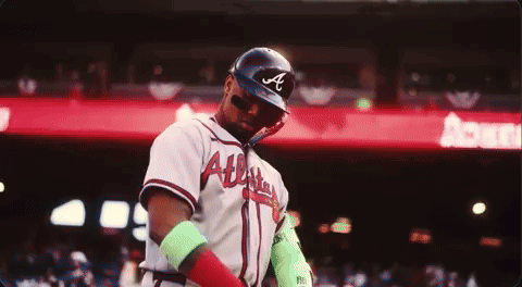A Baseball Player Wearing An Atlanta Braves Uniform GIF