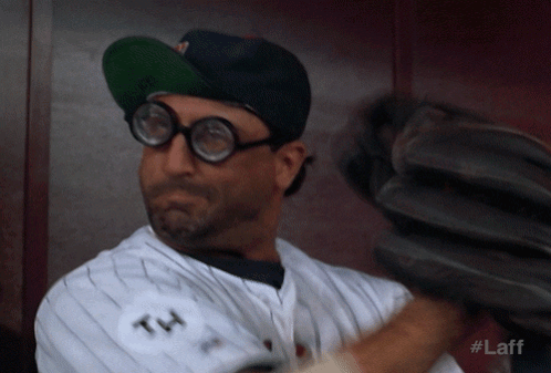 A Baseball Player Wearing Glasses And A Hat With The Number 14 On The Back GIF