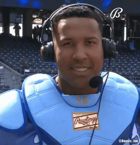 A Baseball Player Wearing Headphones And A Rawlings Shirt GIF
