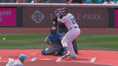 A Baseball Player Wearing Number 22 Swings At A Pitch GIF
