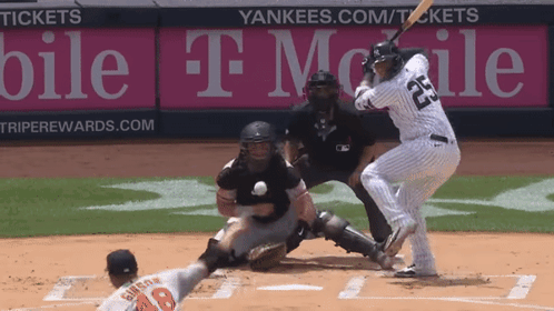 A Baseball Player Wearing Number 23 Is Swinging At A Ball GIF