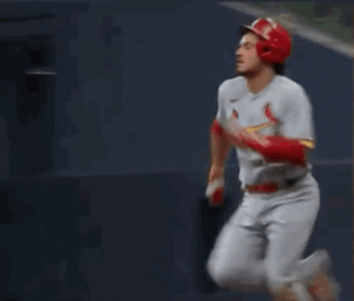 A Baseball Player Wearing Number 28 Is Running Towards Home Plate GIF