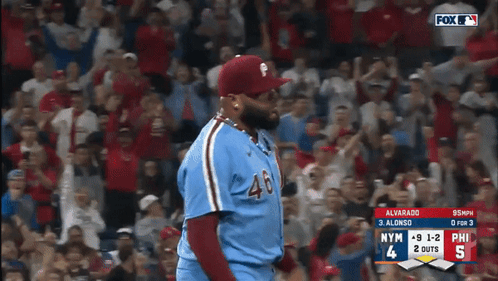 A Baseball Player Wearing Number 46 Stands In Front Of A Crowd GIF
