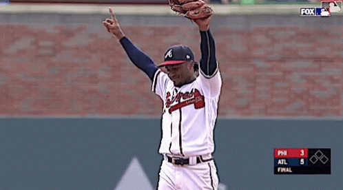 A Baseball Player With The Letter A On His Hat Throws A Ball GIF